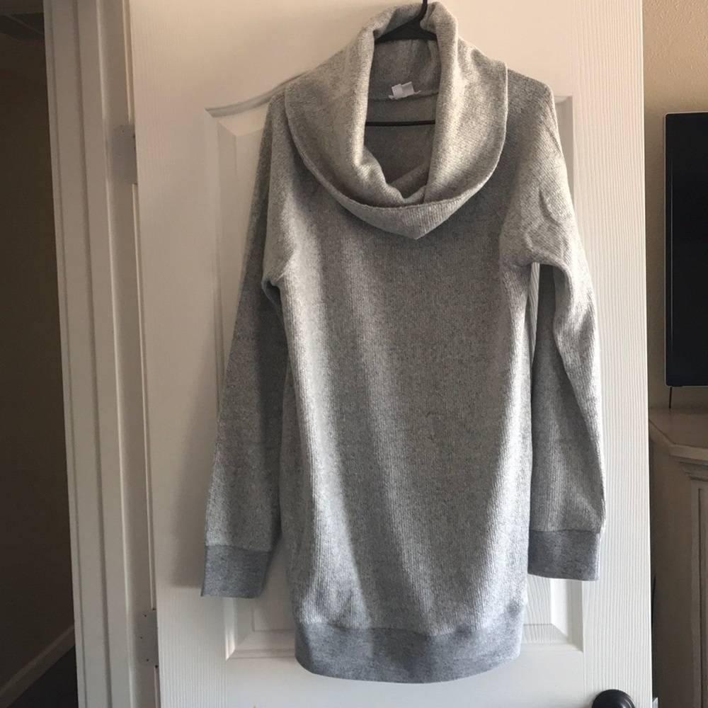 Cool neck over sized sweater .